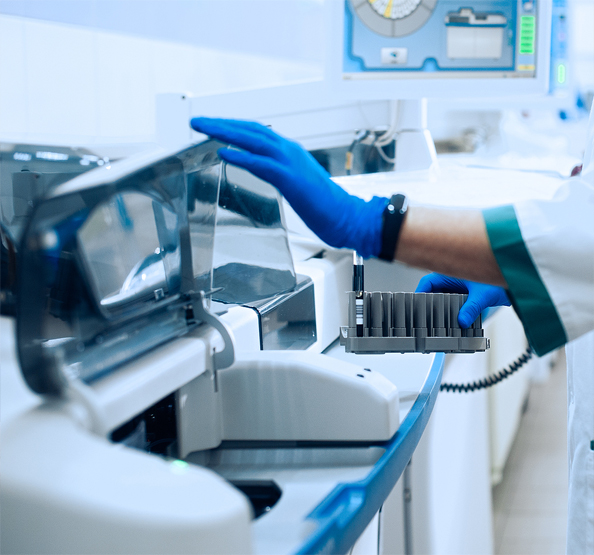 Laboratory technician working with sample processing equipment